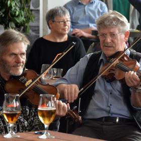 Men playing the violin